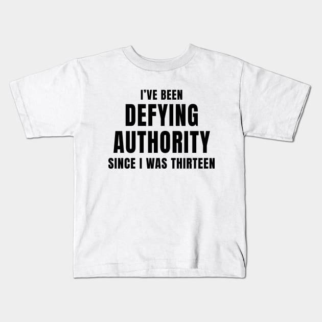 I’ve Been Defying Authority Since I Was Thirteen Kids T-Shirt by quoteee